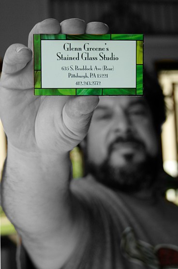 Photo of Glenn Greene holding business card